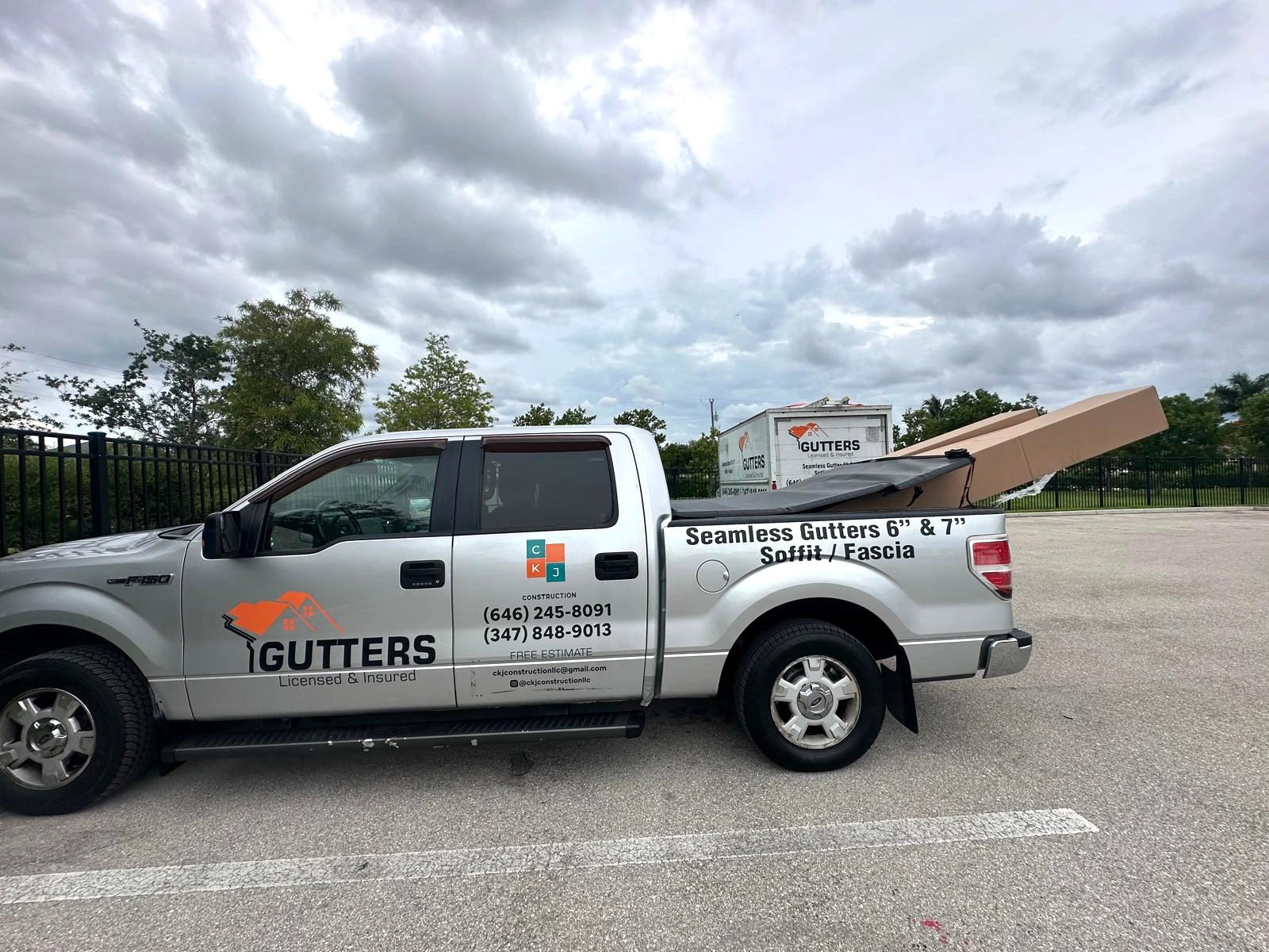 CKJ Construction pickup carrying gutter materials