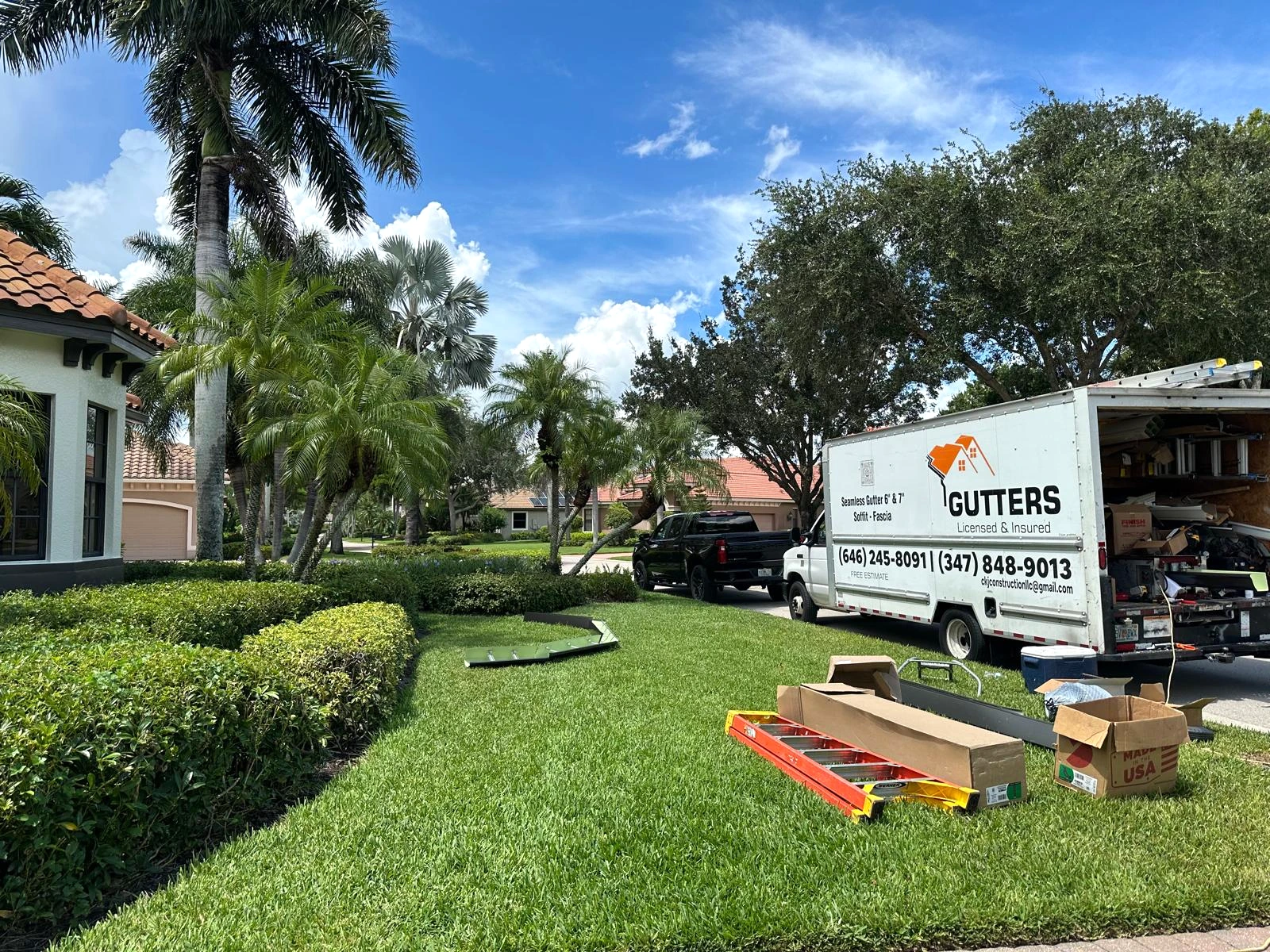 CKJ gutter truck and equipment at a residential job site